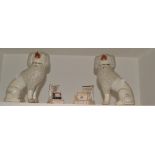 A pair of Staffordshire poodles, shredded clay fur, free front legs, c.