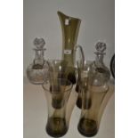 A pair of clear glass decanters and stoppers;