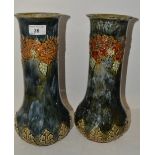 A near pair of Royal Doulton baluster vases, designed by Ethel Beard and W.