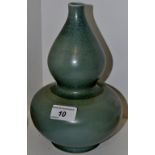 A Chinese monochrome double gourd vase, in a mottled green glaze, 23.