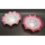 A pair of 19th century Continental glass blush dishes, wavy rim, stipple decoration in relief,
