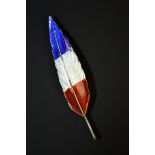 An enamelled silver feather brooch, single tapering feather enamelled with red white and blue bands,