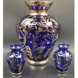 A garniture of three Bristol Blue glass vases,