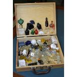 A French pine box containing perfume bottles;  'orchidee', 'cyane', 'Venise', 'Kookat', 'clarins',