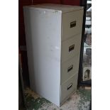 A Triumph four drawer filing cabinet with key.