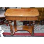 A Victorian mahogany hall table, single drawer to frieze, turned supports, shaped undertier.