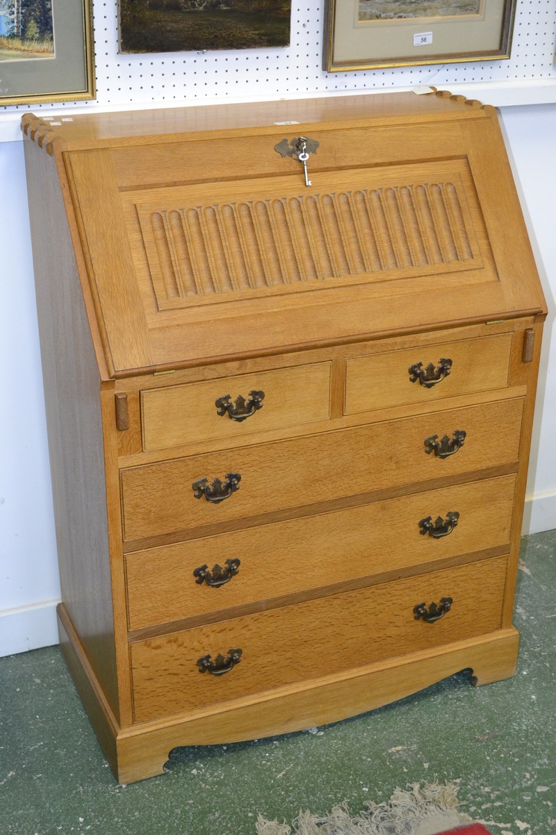 A light oak monastic style bureau, raised dovetail joints to top,