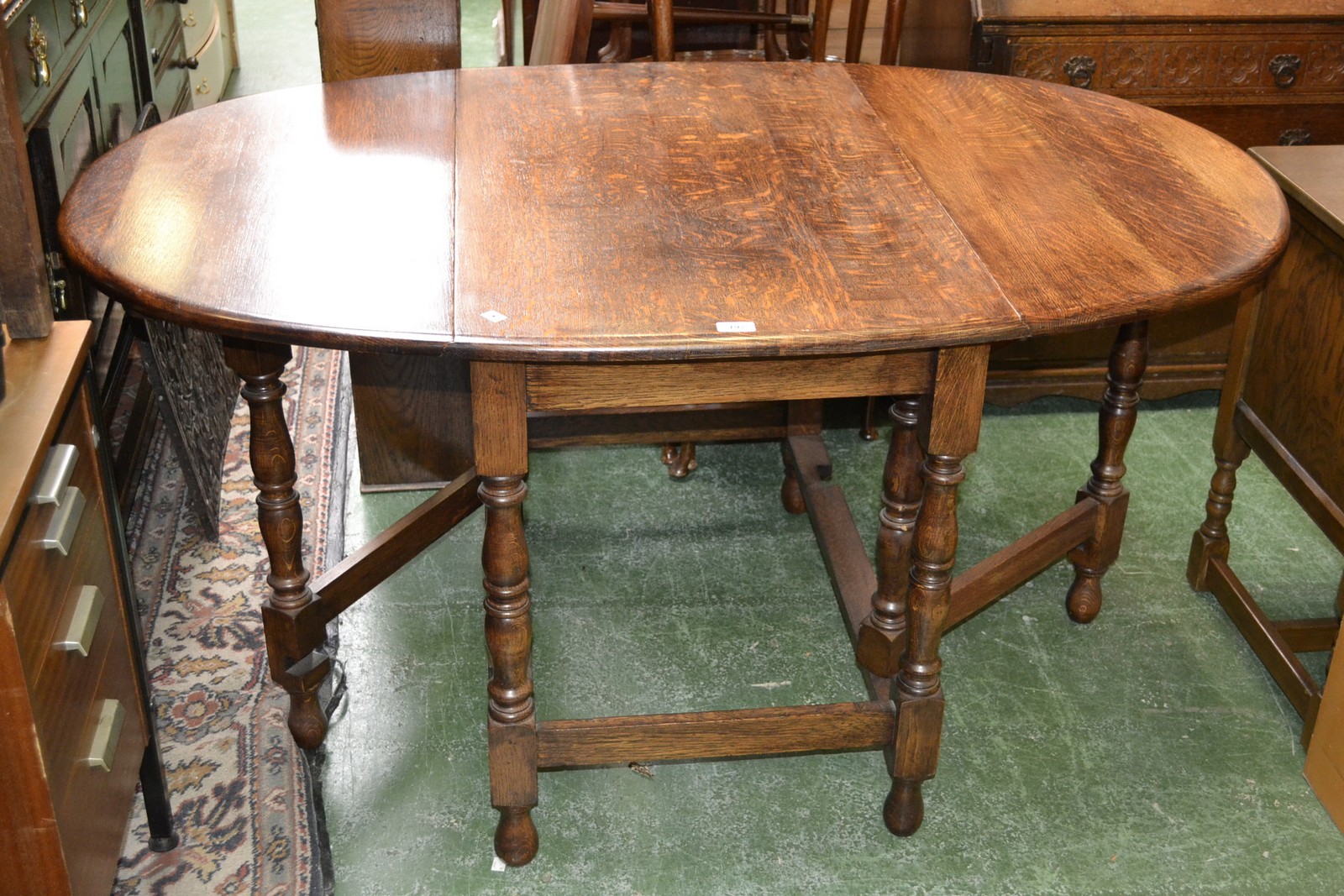 An early 20th century oak gateleg table