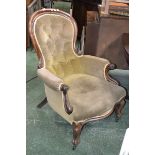 A Victorian mahogany side chair, spoon back, deep button upholstery, scrolling arms,