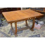 An Art and Crafts oak dining table