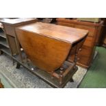 An early 20th century oak gateleg dining table