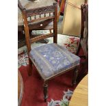 Four Victorian dinner chairs curved top rail, spindled back, stuffed over seat,