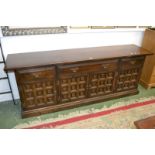 A Younger Furniture Toledo Range long low oak sideboard, oversailing top,