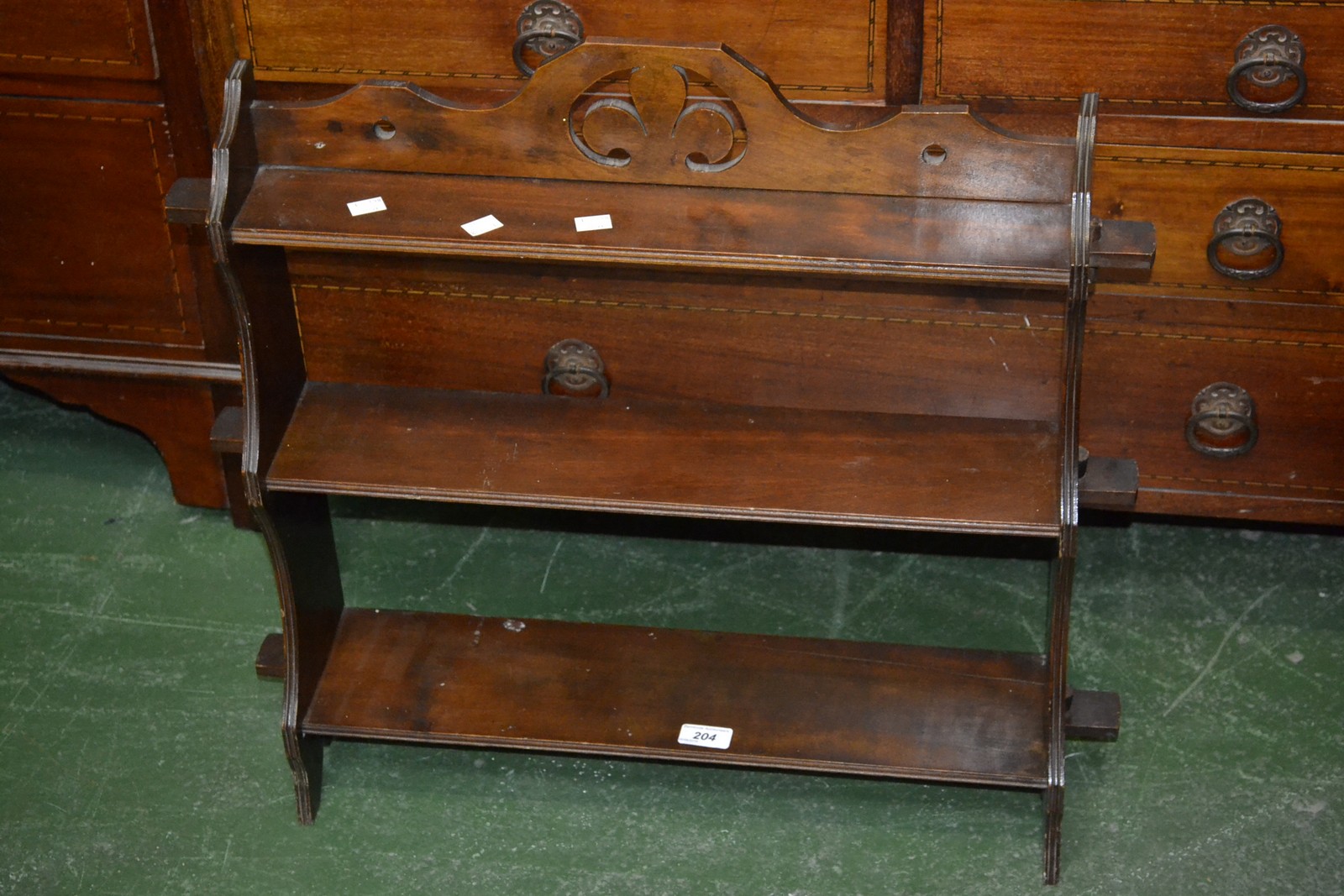 A mahogany three tier wall rack of small proportions. 62cm high x 66cm wide.