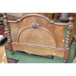 A Victorian mahogany half tester bed, moulded pelmet, arched footboard with barley twist uprights.