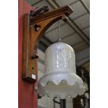 Gothic revival oak wall lamp with etched glass shade