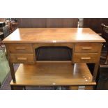 A 1940/50's oak office desk, rounded rectangular top, kneehole flanked by four drawers,