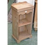 A contemporary pine bedside cabinet.