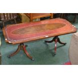 A Regency reproduction coffee table, leather inlaid top, twin pedestal baluster column supports,