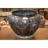 A Japanese bronzed lobed jardiniere, boldly cast with birds and blossom, 25cm high,