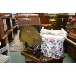 A Singer sewing machine (cased); a pouffe; a folding brass top table;