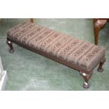 A Victorian mahogany long footstool.