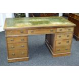 A late Victorian mahogany pedestal desk, tooled leather inlay to top,