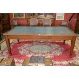 An early 20th century library table, leather inlaid rounded rectangular top,