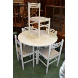 A white painted circular topped kitchen table and five chairs (5)