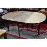 A George III mahogany dining table, oval top tapering cylindrical supports, club feet. 71.