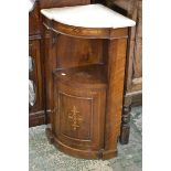 An Edwardian walnut inlaid washstand with marble top over recess and bow front cupboard,