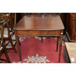 A George III mahogany fold over tea table