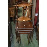 A walnut veneered nest of three tables;