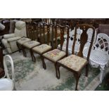 Four Queen Anne style mahogany dining chairs, shaped top rail, vasular splat, drop in seat,