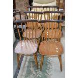 A set of six Danish Billund Stolefabrik spindle back dining chairs.