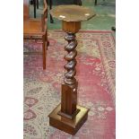 A mahogany jardiniere stand, octagonal top, barley twist column, plinth base.