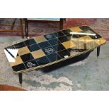 A retro coffee table. chequered top, dansette style legs.