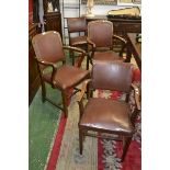 A harlequin set of four 1930/40's oak dining chairs including three carvers, padded back,