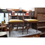 A pair of late Victorian mahogany chairs, bar back, padded seat,