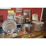 Three Victorian brass and copper jam pans and a Victorian copper kettle,