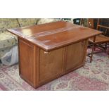A pair of teak side cabinets, fold over sliding top,