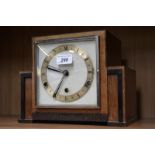 An Art Deco walnut cased mantel clock,