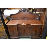 A Victorian inverted breakfront sideboard, shaped gallery, moulded serpentine top,