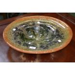 A large impressive WMF Ikora glass bowl, decorated in mottles tones of green, blue,