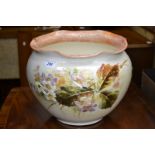 A large Bretby jardiniere, raised in impasto flowers and foliage, signed J Barket,