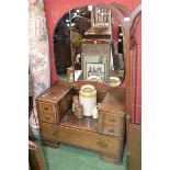 A 1940's oak triptych mirrored dressing table.