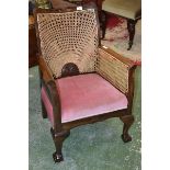 A mahogany library chair, shaped and pierced top rail,