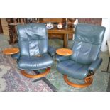 A pair of Norwegian designer Ekornes green leather revolving Stressless chairs with circular swing