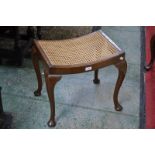 An oak piano stool, cabriole legs,