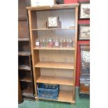 A tall pine open bookcase